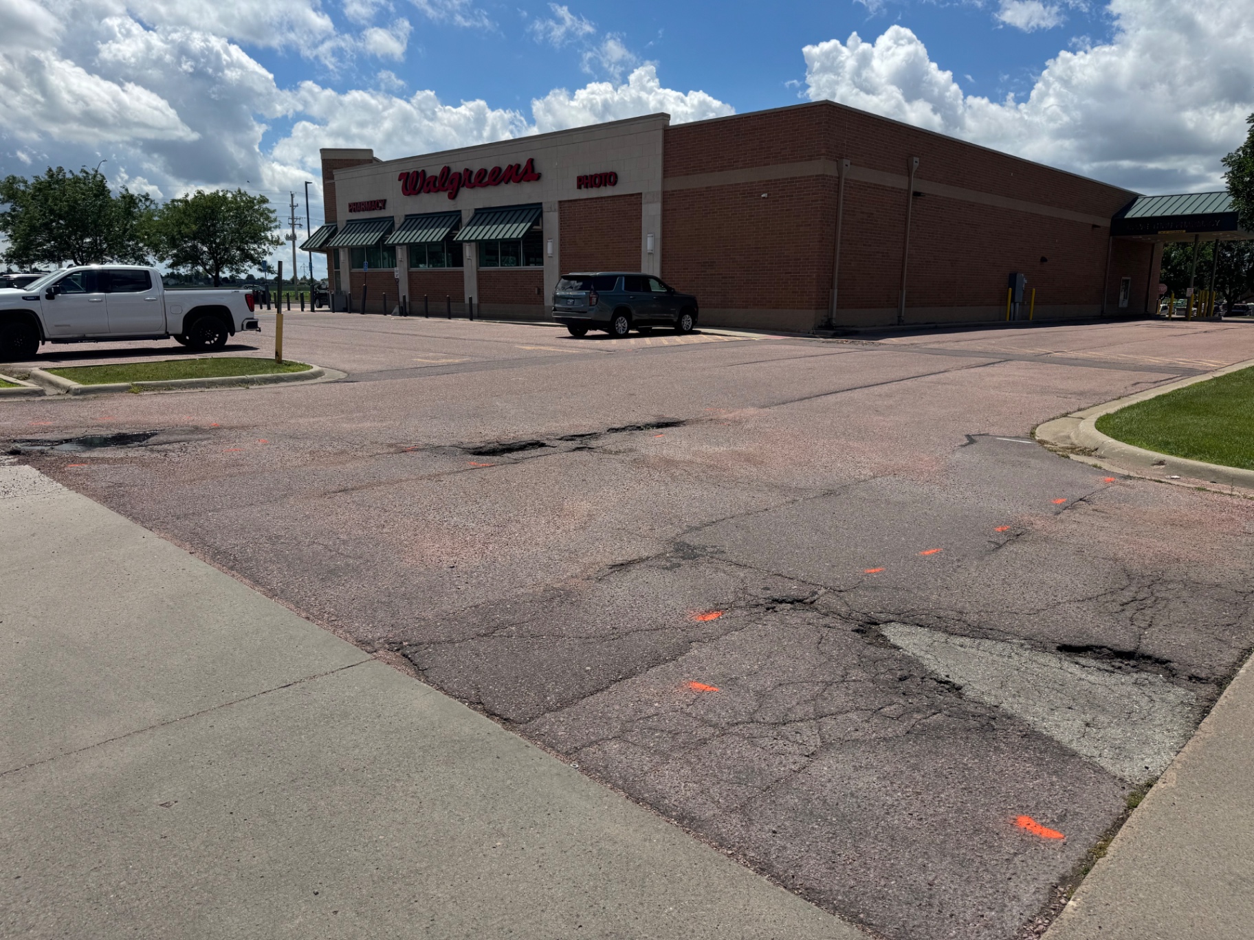 Sioux Falls asphalt pothole repair before and after — before