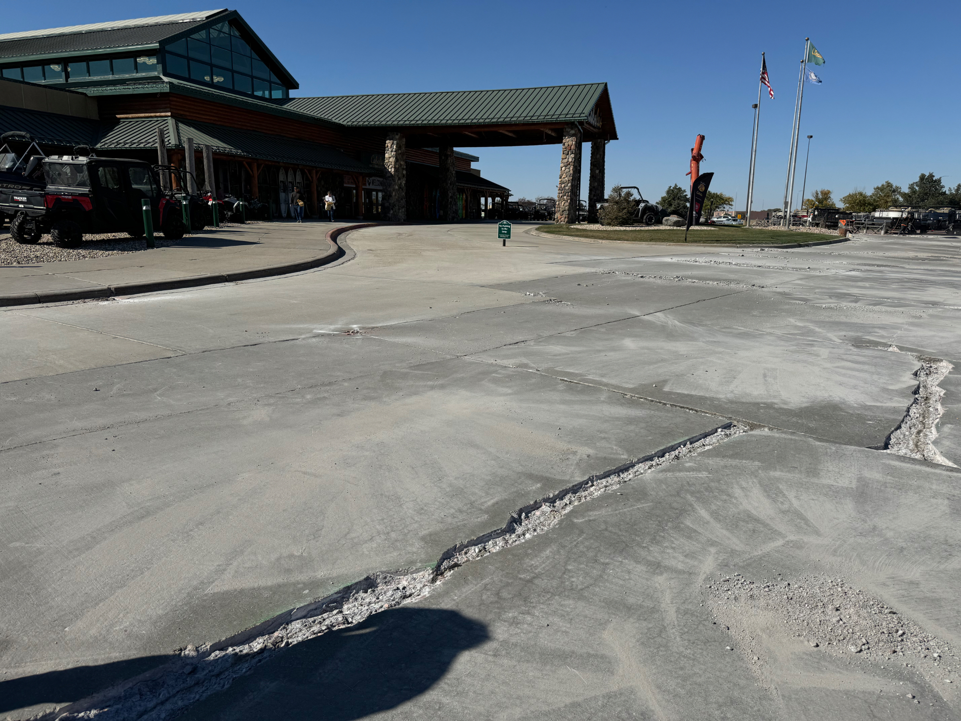 TechCrete concrete restoration at Cabela's Mitchell before and after — Dakota Seal — before